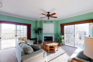 a living room with a couch and a ceiling fan at Sunset Bay III 313 in Ocean City