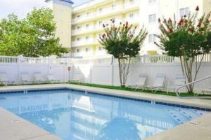 a swimming pool in front of a building at Bahia Vista II 305 in Ocean City