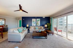 a living room with a couch and a table at Bahia Vista II 305 in Ocean City +17 photos