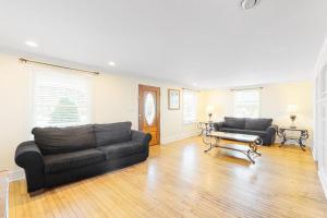 a living room with two couches and a table at 900 Philadelphia in Ocean City