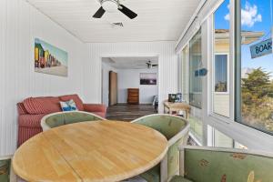 a dining room with a table and chairs at Waterfront Home with OC Skyline Views in Ocean City