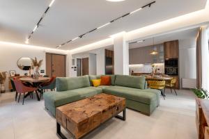 a living room with a couch and a table at PREVEZA VILLA center in Preveza