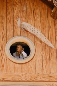 a woman in a bird house with a mirror at Tenuta Colavecchio Wine Relais in Putignano