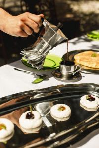 a person is preparing food on a table at Tenuta Colavecchio Wine Relais in Putignano