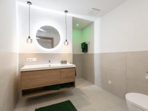 a bathroom with a sink and a mirror at Mosers Apartment in Reith im Alpbachtal +19 photos