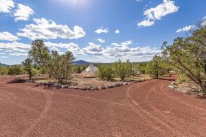 a tent in the middle of a dirt road at The Moon Hotel in Williams