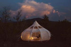 a tent sitting in the middle of a field at The Moon Hotel in Williams