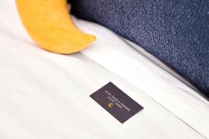 a tag on the lapel of a white shirt at The Moon Hotel in Williams