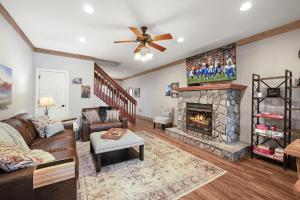 a living room with a couch and a fireplace at License to Chill Boone in Banner Elk