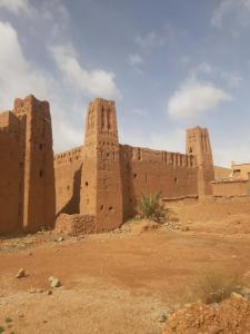 an old building in the middle of the desert at Taddart n Dades in Boumalne Dades +11 photos