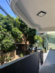 a view from the outside of a building with a fence at A T Homestay in Thôn Dương Xuân Hạ