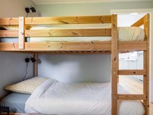 a bunk bed in a tiny house at t Sluisje 8 in Bantega
