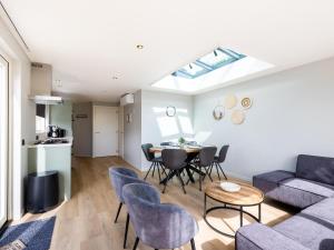 a living room with a couch and a table at t Sluisje 8 in Bantega +21 photos