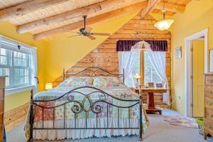 a bedroom with a bed and a wooden ceiling at Wood Road Retreat in Quechee