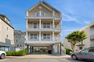 a tall building with a balcony on a street at 16 The Palms in Ocean City