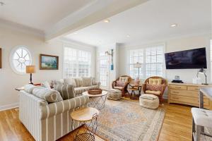 a living room with a couch and a table at 16 The Palms in Ocean City