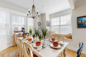 a dining room with a white table and chairs at 16 The Palms in Ocean City +23 photos
