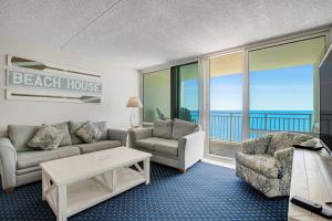 a beach house living room with a view of the ocean at Carousel 1605 in Ocean City