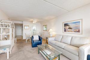 a living room with a couch and a table at English Towers 804 in Ocean City