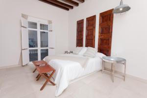 Säng eller sängar i ett rum på Can Savella - Turismo de Interior