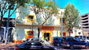 a building with cars parked in front of it at J Alejandro - Centro Histórico Guadalajara in Guadalajara