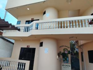 a view of the outside of a house with stairs at Hospedaje Cactus Experience in Puerto Villamil
