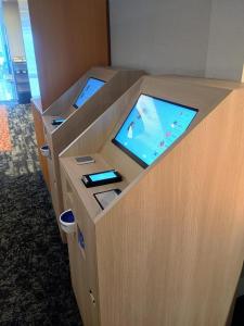 a kiosk with two screens on top of it at Hotel Sunroute Tochigi in Tochigi