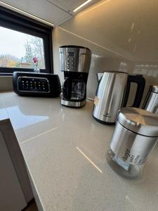 a kitchen counter with a coffeemaker and a coffee maker at MODULAR NUEVA l in San Luis