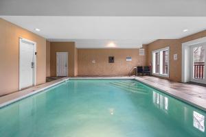 a large swimming pool in a hotel room at Cherokee Pool Lodge in Cosby
