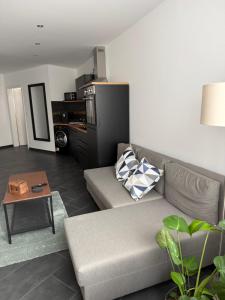 a living room with a couch and a table at RS home CB 1 in Cottbus
