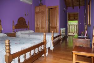 A bed or beds in a room at Posada Sobrevilla