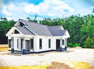 a small white house with a roof at D'Jawa Homestay in Baling