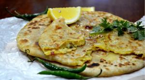 a stack of pancakes with a lemon on a plate at Samarpan in Gorakhpur +10 photos