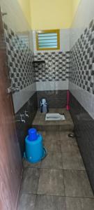 a bathroom with a sink and a toilet in it at Fantasy Homestay in Thiruchendur +5 photos