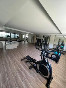 a gym with three exercise bikes in a room at Best Home 38 Triumph in Alanya