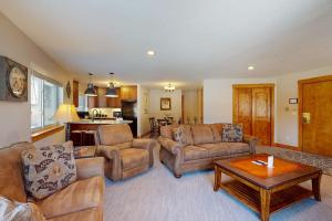 a large living room with couches and a table at Pine Ridge Condos in Breckenridge