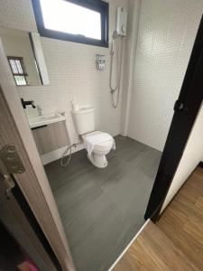 a bathroom with a toilet and a sink at AlinApartment in Ban Sa Kruat +45 photos