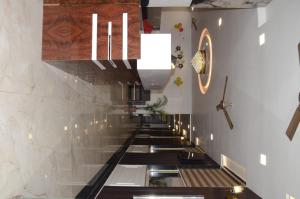 a hallway of a church with a row of stairs at Hotel Empress Gold in Agra +4 photos