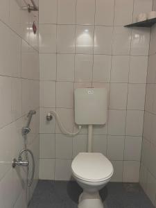 a bathroom with a toilet and a shower at BrightMoon_Homestay in Pondicherry +16 photos