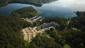 an aerial view of a building next to a lake at Apartament - VIDOK 109 in Olsztyn