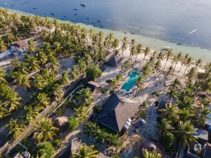 an aerial view of a beach with palm trees at Seed Resort in Nembrala
