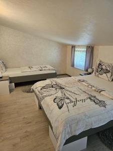 a bedroom with two beds and a window at Apartments Vesna in Bled