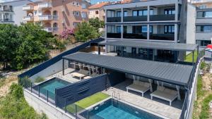 an aerial view of a house with a swimming pool at Villa Twins in Crikvenica