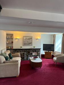 a living room with a couch and a coffee table at 17 French Street in Teignmouth