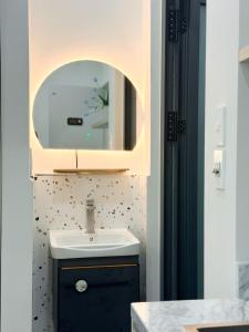 a bathroom with a sink and a mirror at SP house in Ho Chi Minh City +41 photos