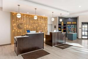 a lobby with desks and pendant lights in a store at Comfort Inn & Suites Verona at Turning Stone Resort Casino in Verona