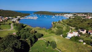 an aerial view of a lake with boats in it at Luxury Villa Meerbrise - Private Pool - Near Medulin, Kamenjak, Pola in Banjole