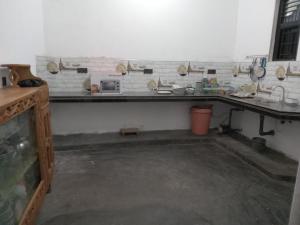 a kitchen with a long counter in a room at Breezy Villa - Arugambay in Arugam Bay +8 photos