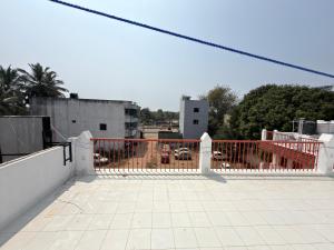 a white fence on top of a building at Gravity Groups VVJ - Jipmer Sangamithra in Puducherry Airpoert