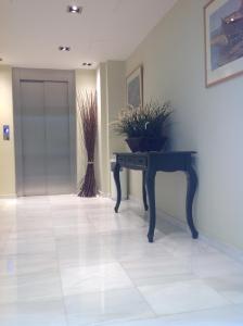 a room with a table with plants on it at Hotel Karthea in Korissia